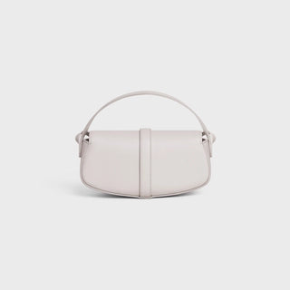 CLUTCH ON STRAP TABOU IN SMOOTH CALFSKIN CHALK