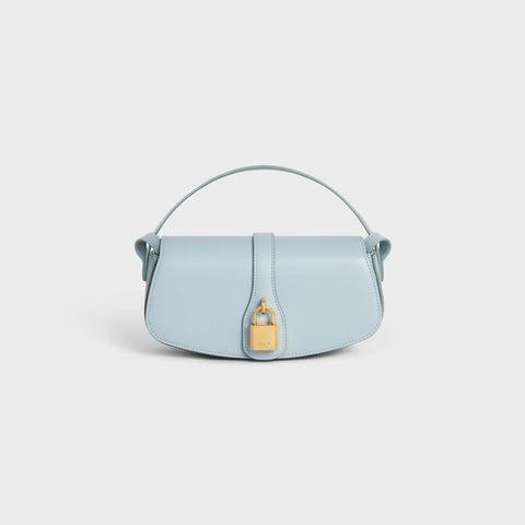 CLUTCH ON STRAP TABOU IN SMOOTH CALFSKIN ICE BLUE