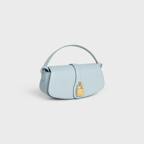 CLUTCH ON STRAP TABOU IN SMOOTH CALFSKIN ICE BLUE