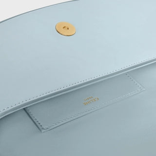 CLUTCH ON STRAP TABOU IN SMOOTH CALFSKIN ICE BLUE