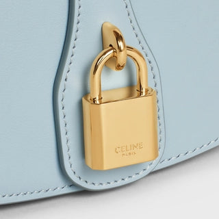 CLUTCH ON STRAP TABOU IN SMOOTH CALFSKIN ICE BLUE