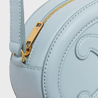 CROSSBODY OVAL PURSE CUIR TRIOMPHE IN SMOOTH CALFSKIN ICE BLUE