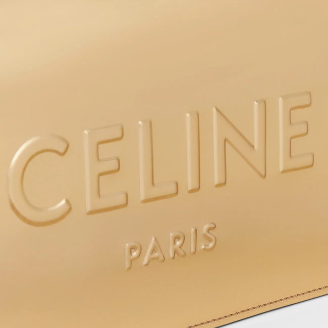 CELINE CLUTCH IN LAMINATED TEXTILE GOLD